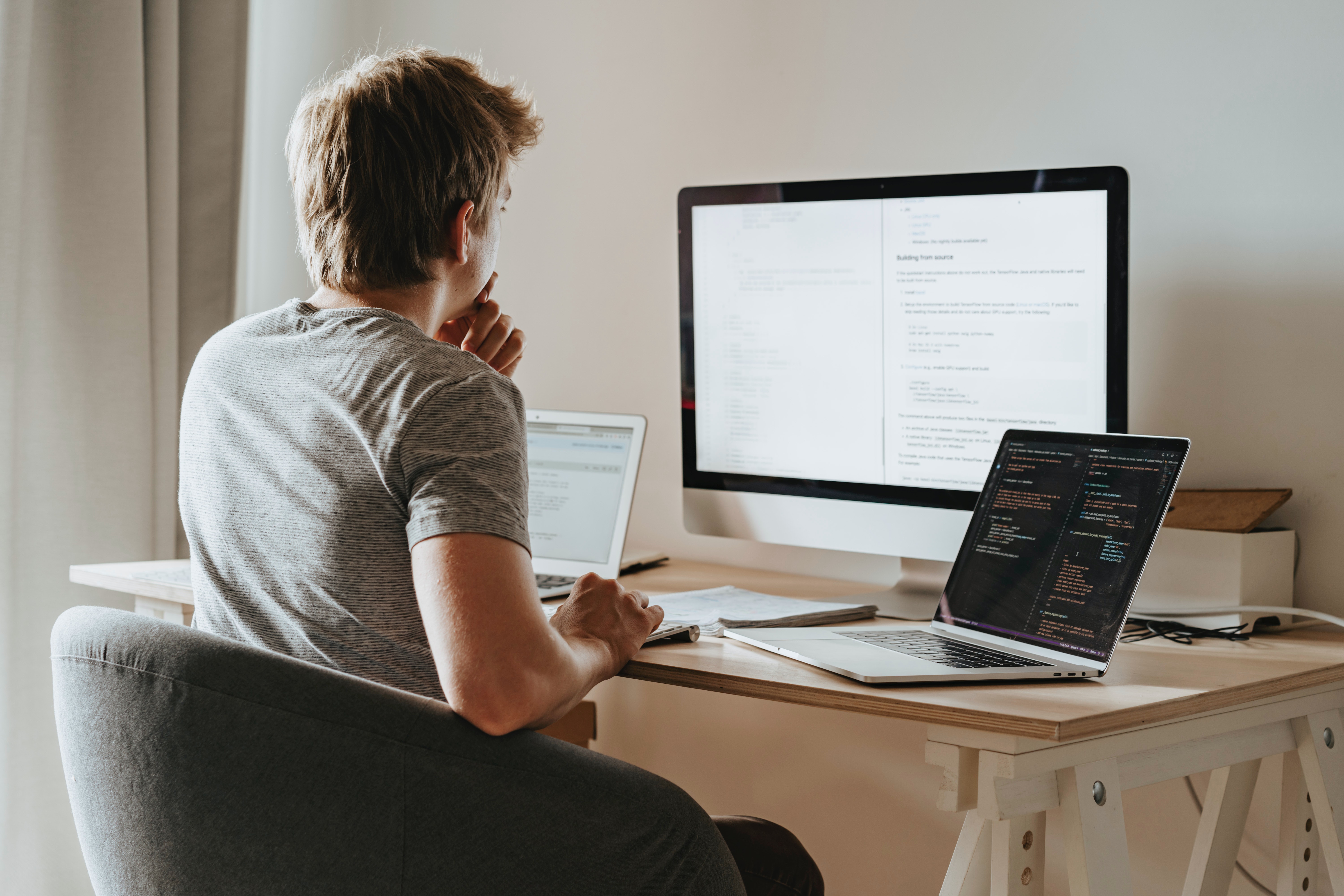 Man at computer with monitor